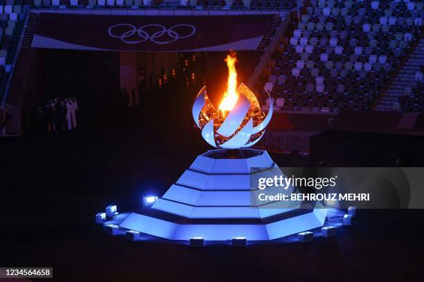 View shows the Olympic Cauldron and the Olympic flame during the closing ceremony of the Tokyo 2020 Olympic Games, on August 8, 2021 at the Olympic...