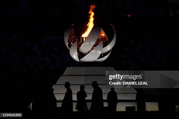 The Olympic Cauldron and the Olympic flame are pictured during the closing ceremony of the Tokyo 2020 Olympic Games, on August 8, 2021 at the Olympic...