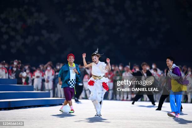 Dancers and musicians perform during the closing ceremony of the Tokyo 2020 Olympic Games, at the Olympic Stadium, in Tokyo, on August 8, 2021.