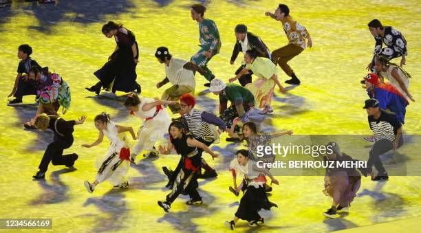 Performers dance during the closing ceremony of the Tokyo 2020 Olympic Games, on August 8, 2021 at the Olympic Stadium in Tokyo.