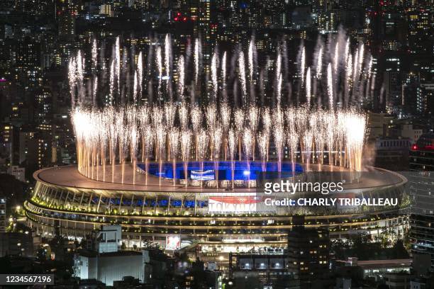Fireworks light up the sky over the Olympic Stadium during the closing ceremony of the Tokyo 2020 Olympic Games, in Tokyo, on August 8, 2021.