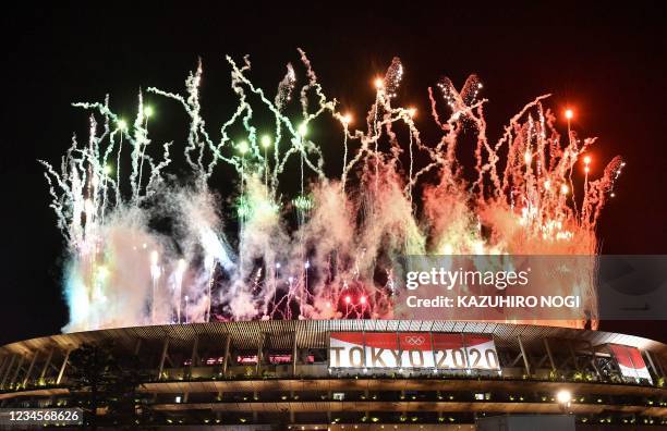 Fireworks go off around the Olympic Stadium during the closing ceremony of the Tokyo 2020 Olympic Games, as seen from outside the venue in Tokyo on...