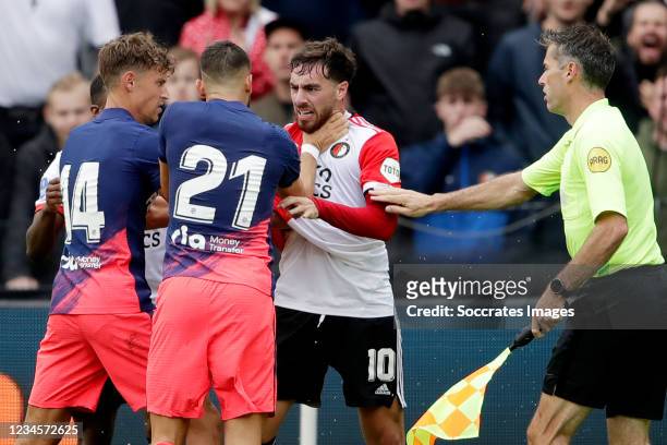 Marcos Llorente of Atletico Madrid, Yannick Carrasco of Atletico Madrid, Orkun Kokcu of Feyenoord, assistant referee Charl Schaap during the Club...