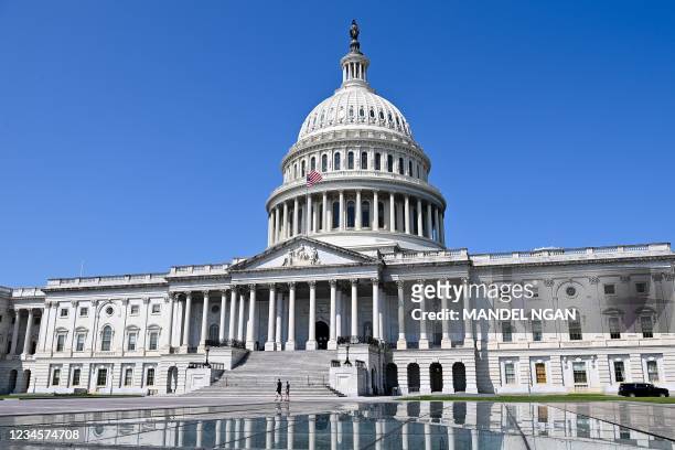 The dome of the US Capitol is seen in Washington, DC on August 8, 2021. - A huge infrastructure bill deemed historic by US President Joe Biden passed...
