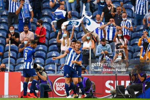 Toni Martinez of FC Porto celebrates with teammates after he scores his sides first goal during the Liga Bwin match between FC Porto and Belenenses...