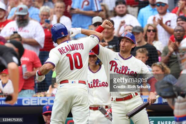 Realmuto of the Philadelphia Phillies is congratulated by Brad Miller after he hit a home run against the New York Mets during the first inning of a...