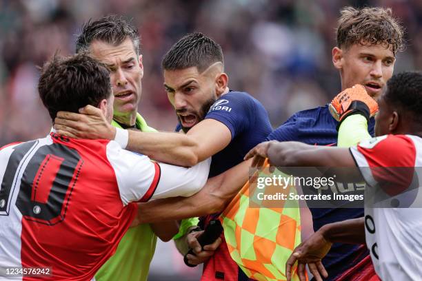 Orkun Kokcu of Feyenoord, assistent referee (Charl Schaap , Yannick Carrasco of Atletico Madrid, during the Club Friendly match between Feyenoord v...