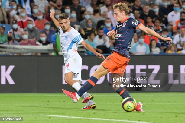 Cengiz UNDER of Marseille and Nicolas COZZA of Montpellier during the Ligue 1 football match between Montpellier and Marseille at Stade de la Mosson...