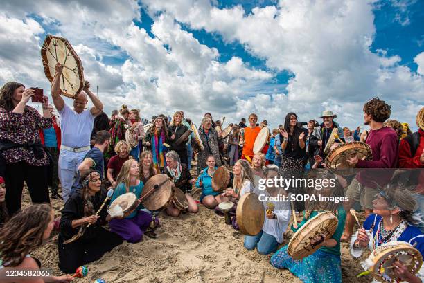 Participant in an inner circle, chant, wail and dance during the 'Gathering of Drums'. Hundreds of New-age protesters gathered to chant, dance and...