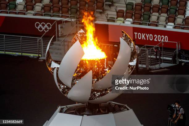 Closing Ceremony at the Olympic Stadium. The Olympic fire burns during the closing ceremony