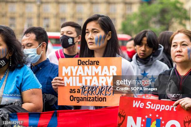 Protestor holds a placard that says Declare military as a terrorist organization during the demonstration. On 8th August 1988, students led what is...