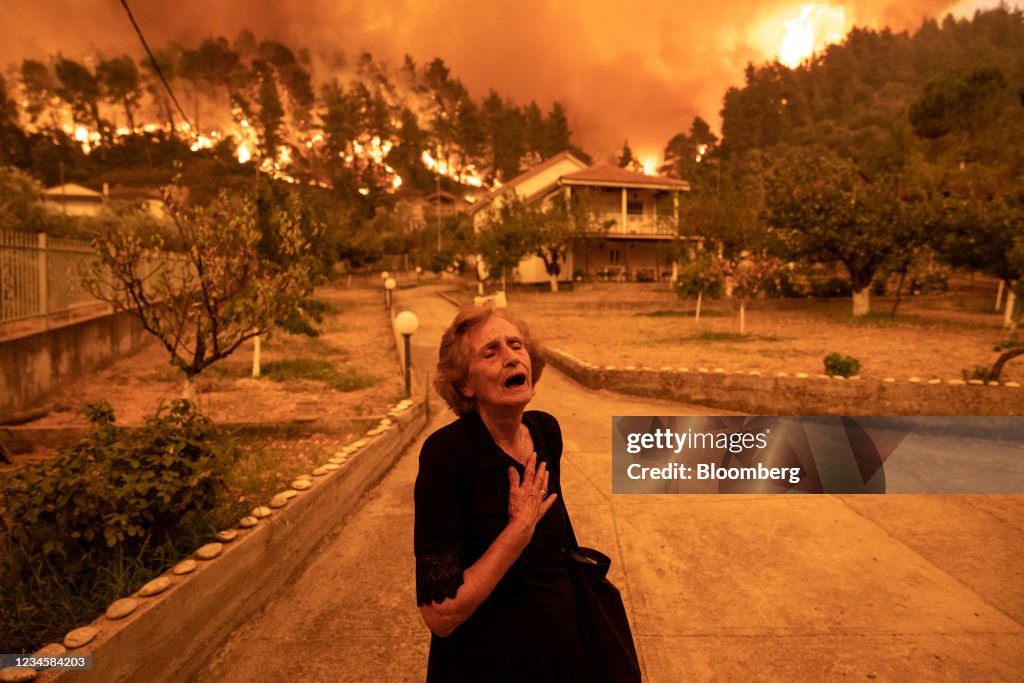 Residents Evacuate Greek Island Hit By Wildfires