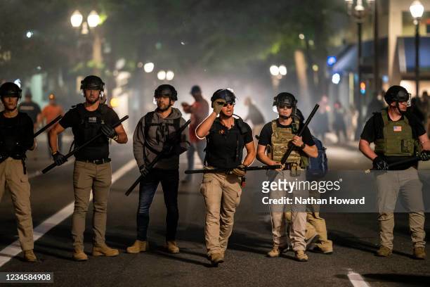 Far-right extremists regroup after clashing with anti-fascists on August 8, 2021 in Portland, Oregon. Anti-fascists and far-right extremists clashed...