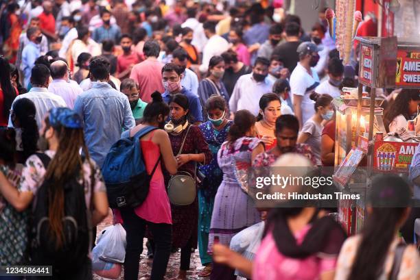 Shoppers flout covid norms as they shop at Sarojini Nagar market amid the Covid-19 pandemic, on August 8, 2021 in New Delhi, India.