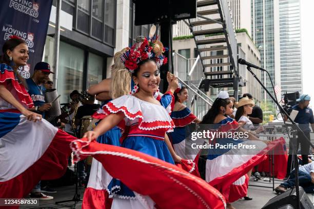 Atmosphere during Dominican parade as dancers perform on stage on 6th Avenue. Parade was significantly scaled down because of COVID-19 pandemic and...