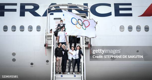 President of French National Olympic Committee Brigitte Henriques and French Delegate Minister of Sports Roxana Maracineanu watch as President of the...