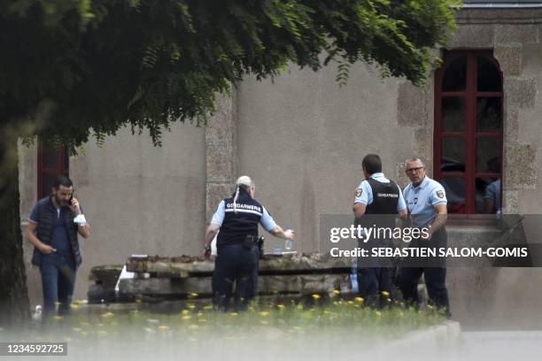 French gendarmes gather at the place where a French catholic priest, aged 60, has been murdered in Saint-Laurent-sur-Sevre, Western France, on August...