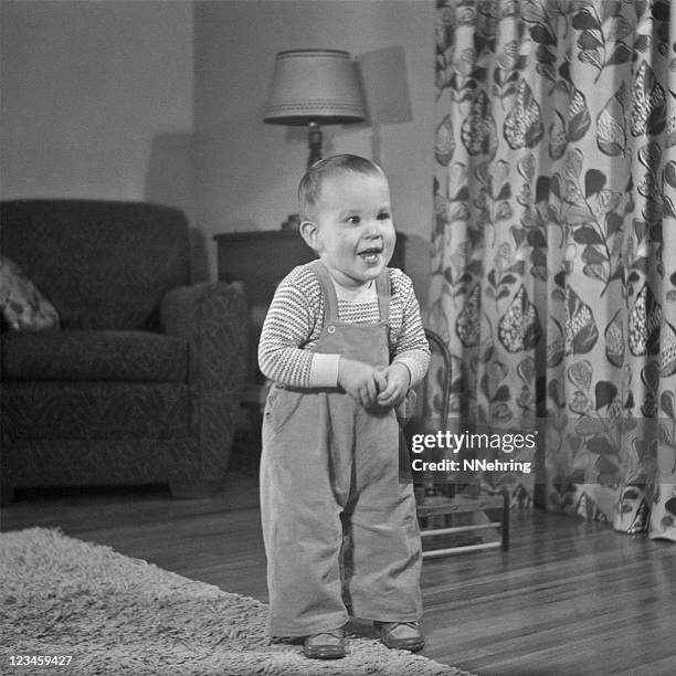 toddler standing in living room 1952, retro - 1952 stock pictures, royalty-free photos & images