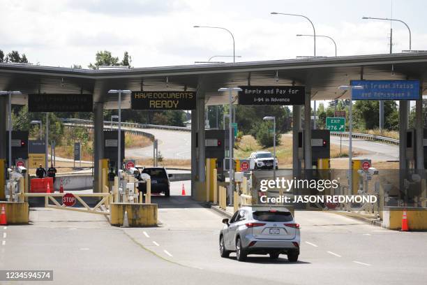 Vehicle approaches the USA-Canada border to enter the USA, which is still closed to Canadians for non-essential travel, on the same day Canada...