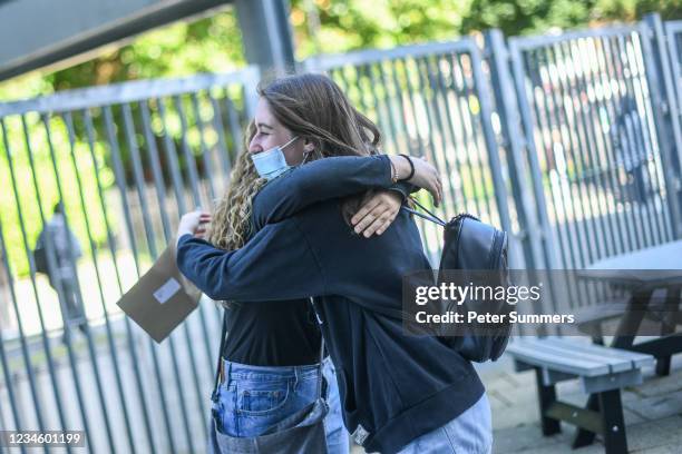 Students from City and Islington College embrace after receiving their A-level results on August 10, 2021 in London, United Kingdom. Sixth Form...