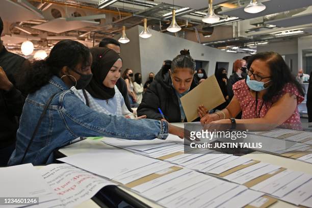 Students at the London Academy of Excellence Tottenham receive their A-Level results in north London on August 10, 2021.