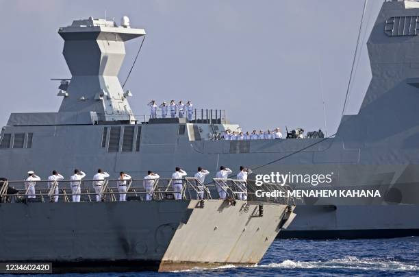 Israeli sailors salute aboard the Atzmaut warship , a Saar 6 corvette, during a welcome ceremony by the Israeli Navy after its arrival from Germany,...