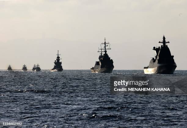 Flotilla of Israeli navy ships sails during a welcome ceremony for the Atzmaut warship, a Saar 6 corvette, after its arrival from Germany, on August...
