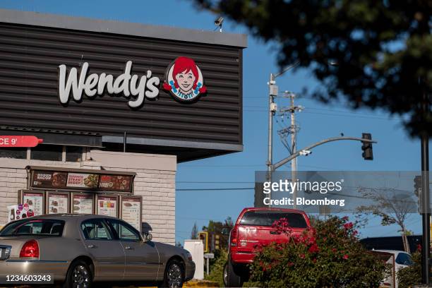 The drive-thru line at a Wendy's restaurant in Pinole, California, U.S., on Monday, Aug. 9, 2021. Wendy's Co. Is expected to release earnings figures...