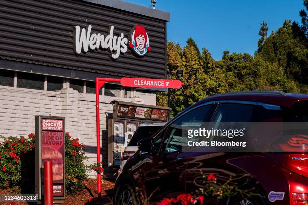 The drive-thru line at a Wendy's restaurant in Pinole, California, U.S., on Monday, Aug. 9, 2021. Wendy's Co. Is expected to release earnings figures...