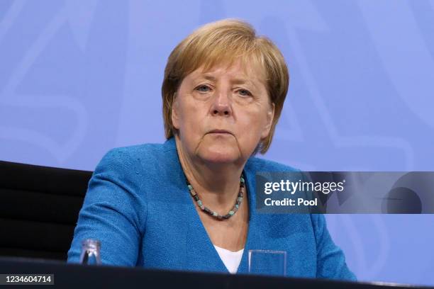 German Chancellor Angela Merkel attends a press conference after a virtual meeting with German state leaders about the current coronavirus situation,...