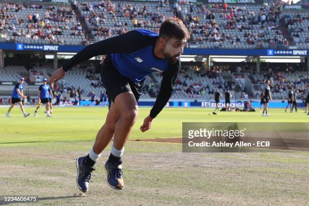 Mohammad Amir of London Spirit warms up prior to The Hundred match between Manchester Originals Men and London Spirit Men at Emirates Old Trafford on...