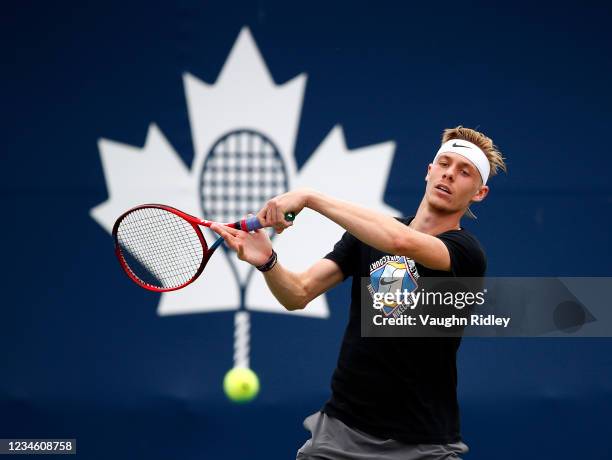 Denis Shapovalov of Canada hits balls on a warm up court on Day Two of the National Bank Open at Aviva Centre on August 10, 2021 in Toronto, Ontario,...