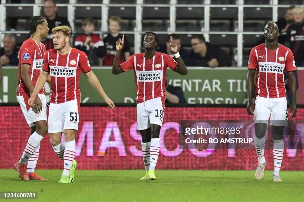 Eindhoven's Bruma celebrates scoring the winning goal with teammates during the UEFA Champions League third qualifying round 2nd leg football match...