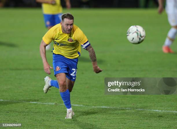 Aiden McGeady of Sunderland sprits after the ball during the Carabao cup match between Port Vale and Sunderland at Vale Park on August 10, 2021 in...