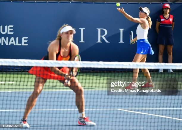 Ellen Perez of Australia remains focused as teammate Kveta Peschke of the Czech Republic prepares to serve during their Womens Doubles match against...