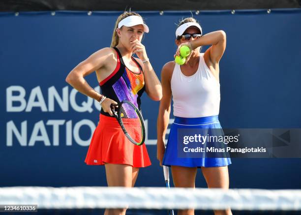 Ellen Perez of Australia and Kveta Peschke of the Czech Republic talk over their strategy during their Womens Doubles match against Lyudmyla Kichenok...