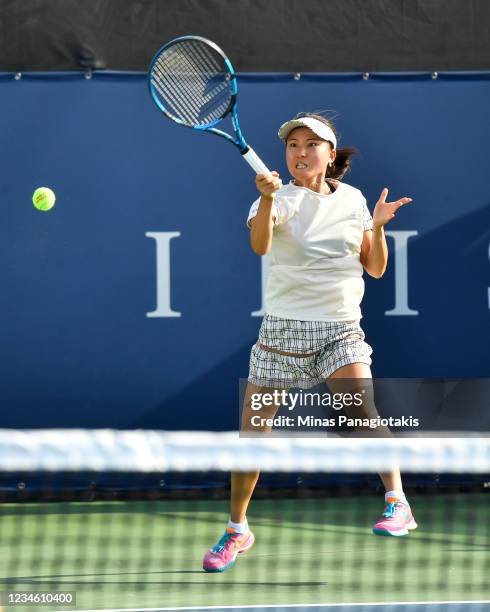 Makato Ninomiya of Japan hits a return during her Womens Doubles match against Ellen Perez of Australia and Kveta Peschke of the Czech Republicon Day...