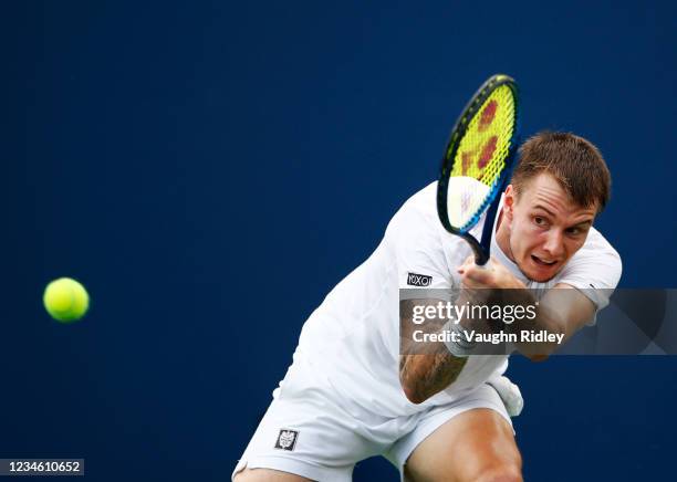 Alexander Bublik of Kazakhstan hits a shot against Daniil Medvedev of Russia during a second round match on Day Two of the National Bank Open at...