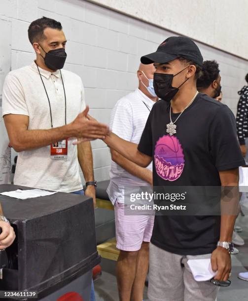 Landry Fields and Trae Young of the Atlanta Hawks shake hands during Day 1 of the 2021 Las Vegas Summer League on August 8, 2021 at the Thomas & Mack...