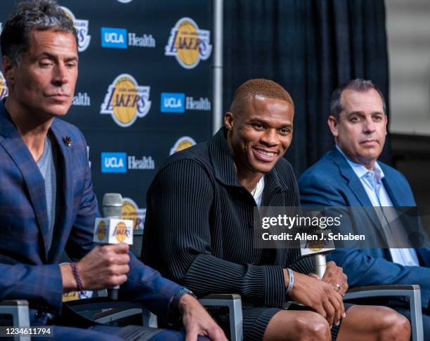 Los Angeles, CA Russell Westbrook, center, speaks after being introduced to the media as one of the newest Lakers by vice president of basketball...