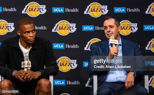 Los Angeles, CA Russell Westbrook, left, listens to Lakers head coach Frank Vogel speak during an introduction press conference at the Staples Center...