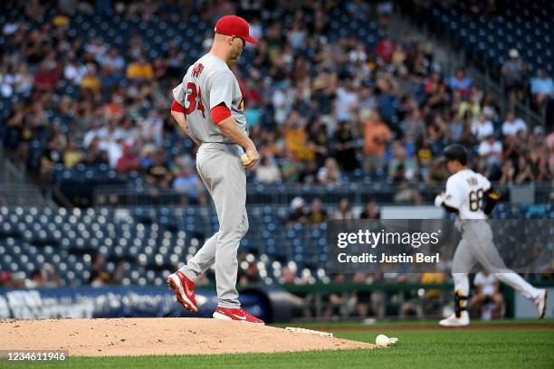 Happ of the St. Louis Cardinals steps off the mound as Hoy Park of the Pittsburgh Pirates rounds the bases on a solo home run in the fourth inning at...