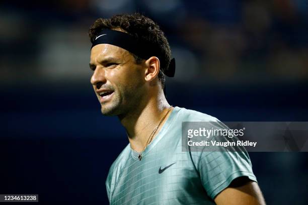Grigor Dimitrov of Bulgaria reacts during a second round match against Reilly Opelka of the United States on Day Two of the National Bank Open at...