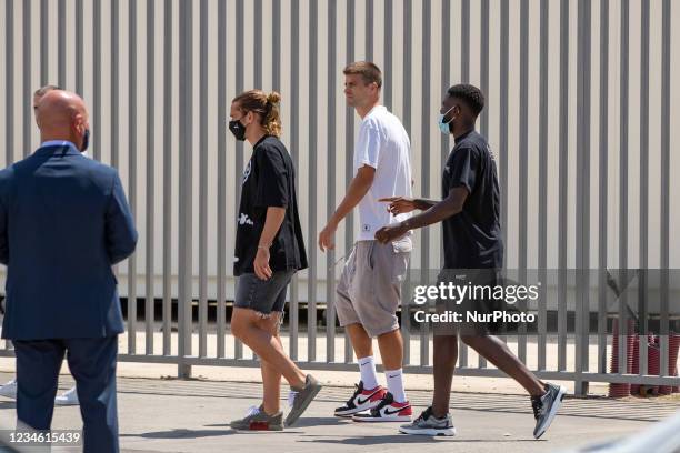 Antoine Griezmann, Gerard Pique and Samuel Umtiti arrives to Lionel Messi farewell press conference at Auditori 1899 at Camp Nou Stadium in...