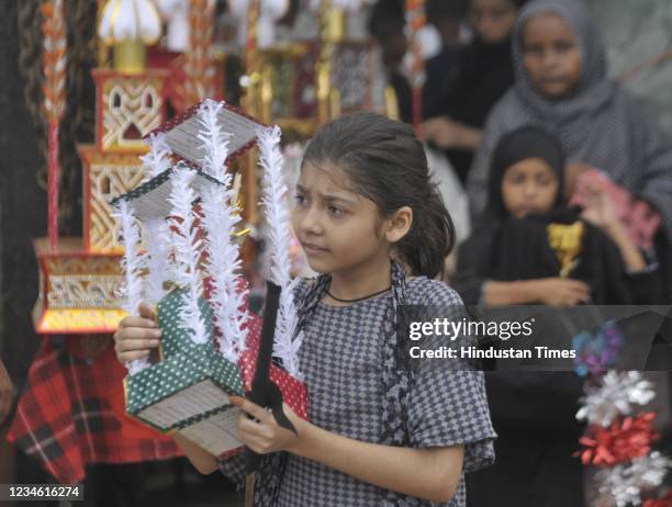Child seen with Tajia ahead of Muharram, at Rauza-e Kazman old city, on August 10, 2021 in Lucknow, India. Muharram -- also known as...