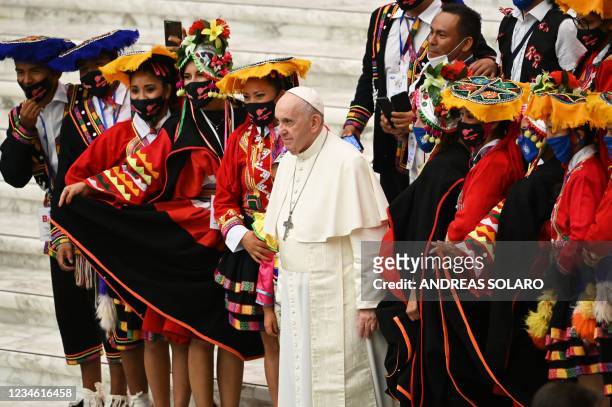 Pope Francis poses with faithful from Peru during his weekly general audience on August 11, 2021 at Paul VI hall in the Vatican.