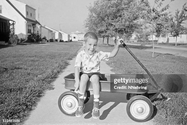 boy in wagon 1957, retro - old photograph stock pictures, royalty-free photos & images