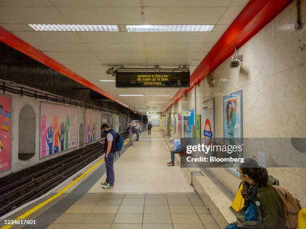 Morning commuters on the platform of the Waterloo & City Line at Waterloo Underground station in London, U.K., on Friday, July 9, 2021. With the vast...
