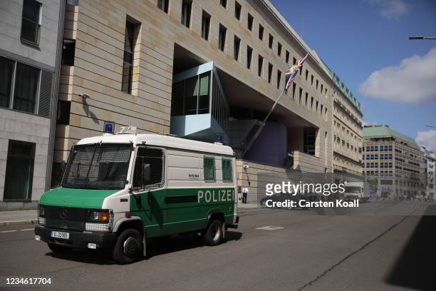 Policecar stays outside the British Embassy on August 11, 2021 in Berlin, Germany. German law enforcement authorities announced today that they have...