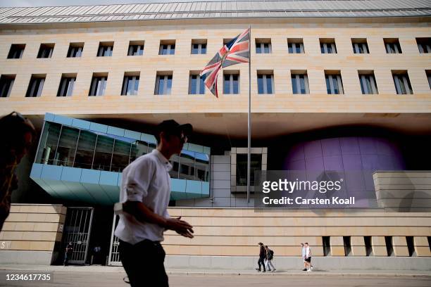 People pass by outside the British Embassy on August 11, 2021 in Berlin, Germany. German law enforcement authorities announced today that they have...